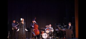 Photo of Karen Meeks and the Blue River Soul Band performing onstage.